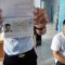 Petugas menunjukkan paspor milik salah seorang warga negara China yang masuk secara ilegal